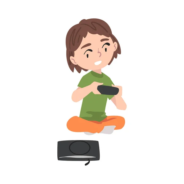 Chica emocionada sentada en el piso con Joystick, niño jugando video juego estilo de dibujos animados Vector ilustración — Vector de stock