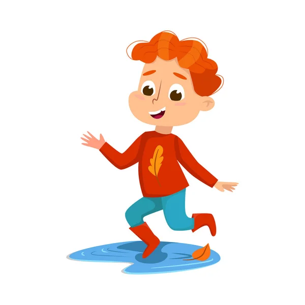 Leuke jongen springen in plas dragen rubberen laarzen, Happy Kid spelen buiten in de herfst cartoon stijl vector illustratie — Stockvector