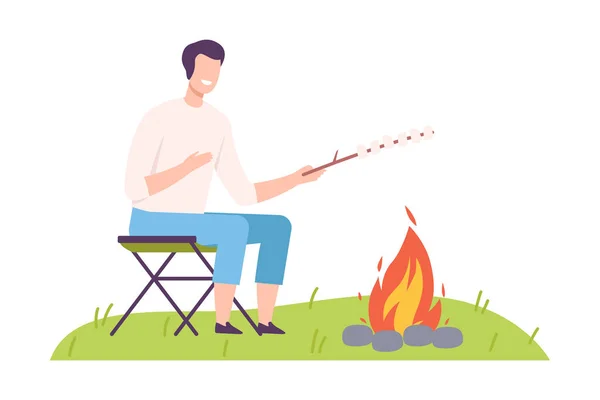 Man Camper Sitting on Chair at Campfire and Frying Marshmallow Vector Illustration — Stock Vector