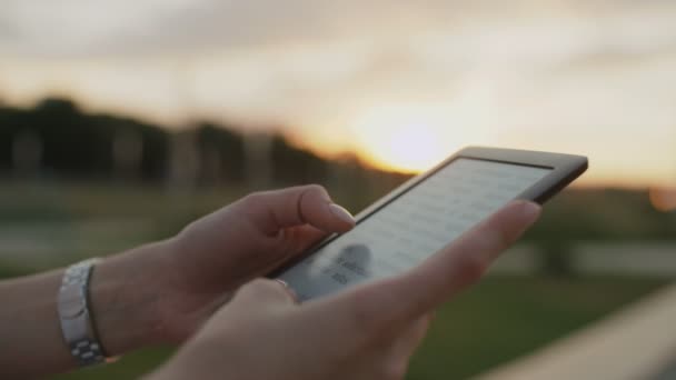 Close up of womans hands with ebook — Stock Video