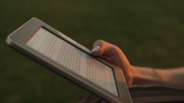 Close up of womans hands with ebook — Stock Video