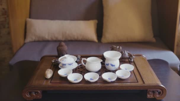 Classical Chinese Tea Ceremony with keetle. Chinese dragon and buddha — Stock Video