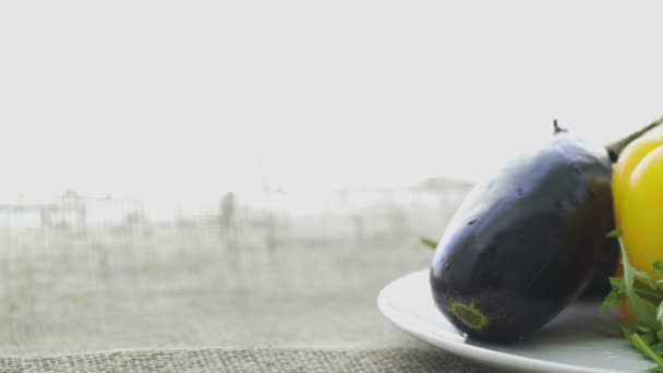 Eggplant, pepper and ginger on plate — Stock Video