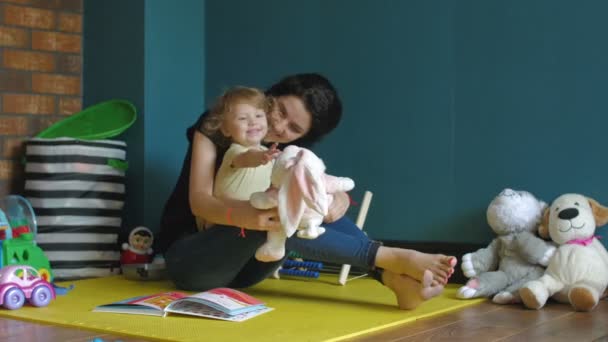 Mother and daughter playing with Stuffed Bunny — Stock Video