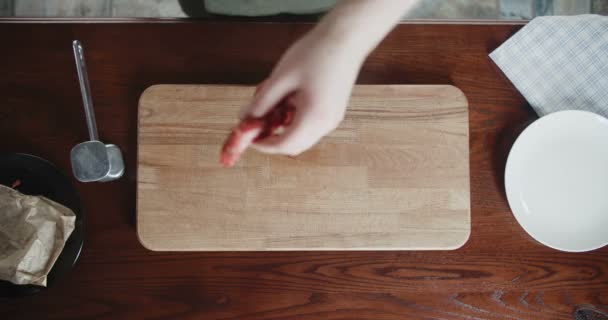 Top voew of the cook beats meat on a cutting board — Stock Video