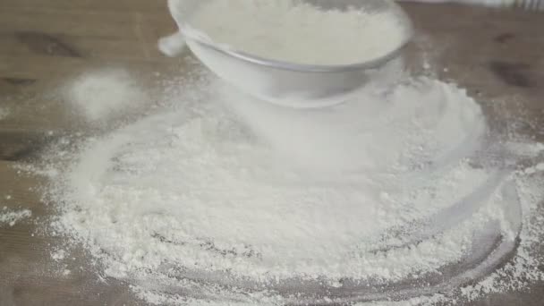 Flour falling through sieve — Stock Video