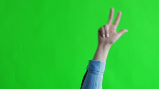 Schermo verde. Chromakey. Mano femminile mostra tre dita — Video Stock