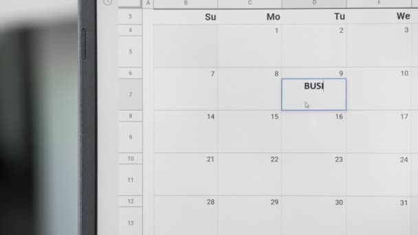 Написання BUSSINES MEETING на 9-му календарі, щоб пам'ятати цю дату . — стокове відео