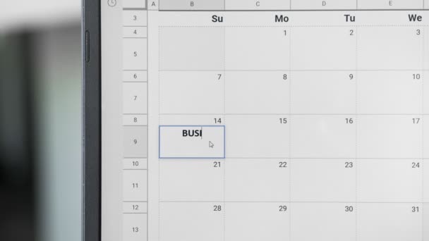 Escribir REUNIÓN DE NEGOCIOS el día 14 en el calendario para recordar esta fecha . — Vídeos de Stock