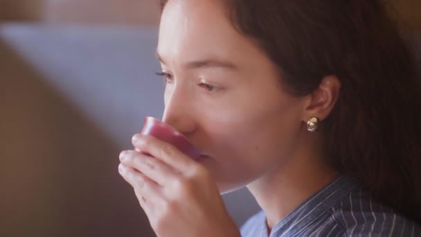 Side view of Woman is drinking tea — Stock Video