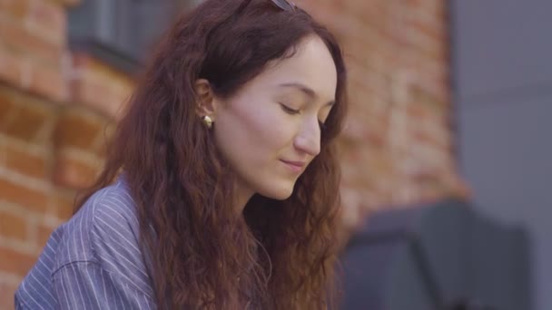 Beautiful, young woman drinking tea — Stock Video