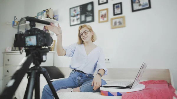Young blogger making her video for blog. The girl finish her recording and waving hand — Stock Photo, Image