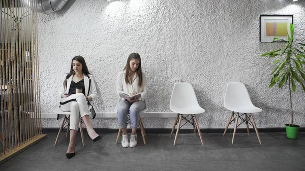 Business people group sitting in row on chairs, three job applicants await for their turn in queue — Stock Photo, Image