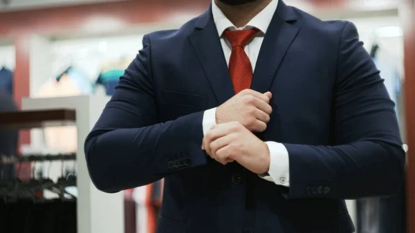 Business man in white shirt buttoning his suit jacket — Stock Photo, Image