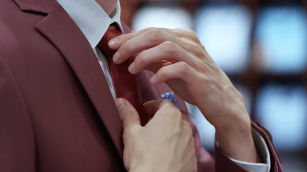 Side View of Young Business Man Fixing his Tie — Stock Photo, Image