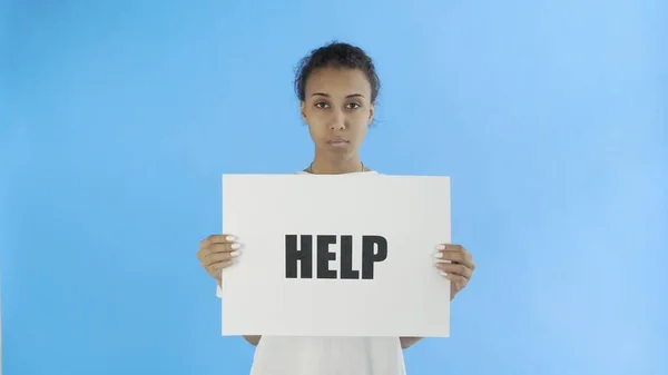 Afro-American Girl Activist With HELP Poster on blue background — Stock Photo, Image