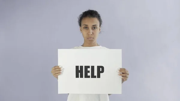 Afro-American Girl Activist With HELP Poster on grey background — Stock Photo, Image