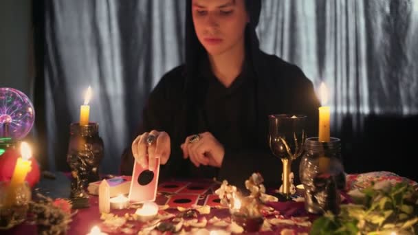 Close up of male fortune teller reading occult tarot cards — Stock Video