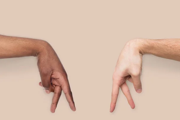 Walking diverse male fingers on beige background — Stock Photo, Image