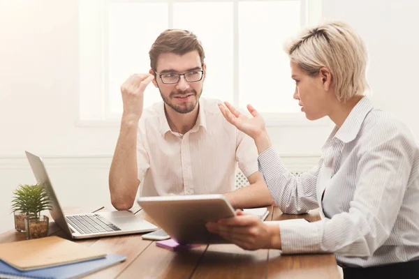 Couple of business partners work at modern office