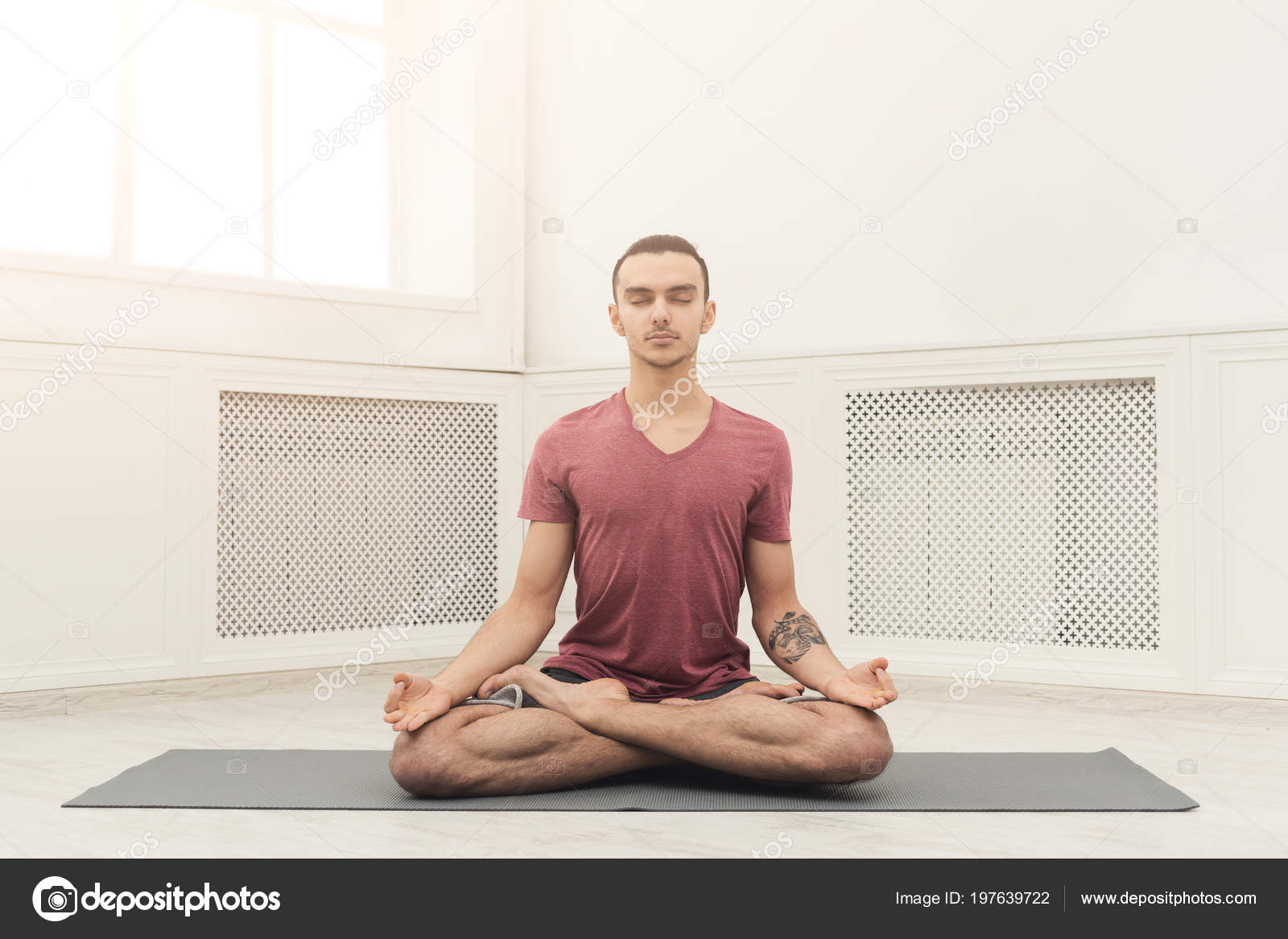 Young man practicing yoga, relax meditation pose Stock Photo by