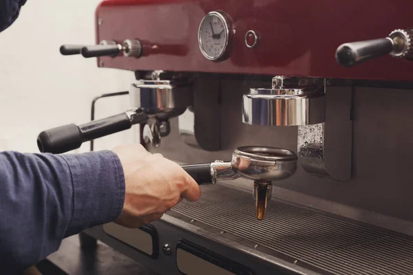 Closeup of barmen hand brewing espresso in cafe — Stock Photo, Image