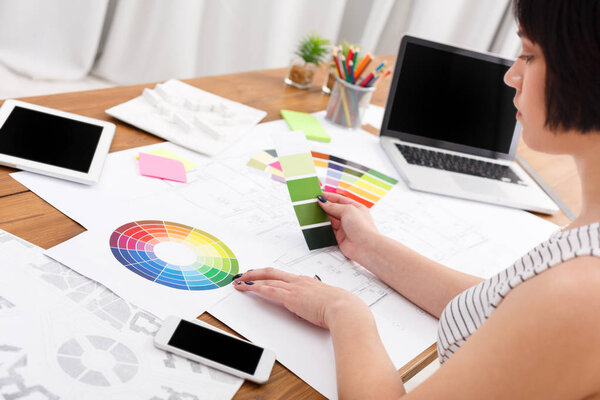 Designers working table with color palette