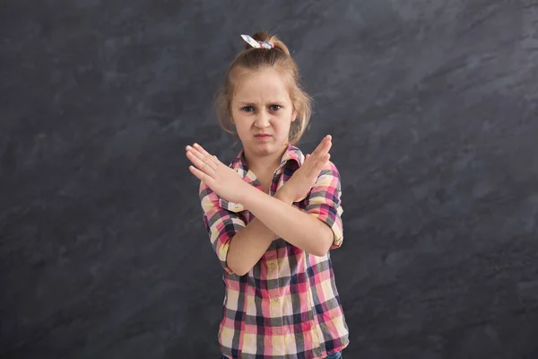 Girl making stop sign with crossed hands — Stock Photo, Image