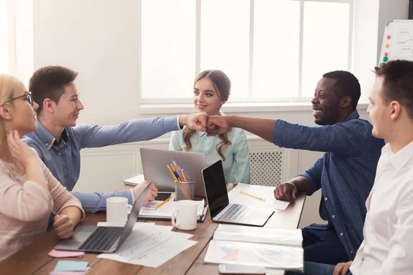 Successful business team bumping fists — Stock Photo, Image