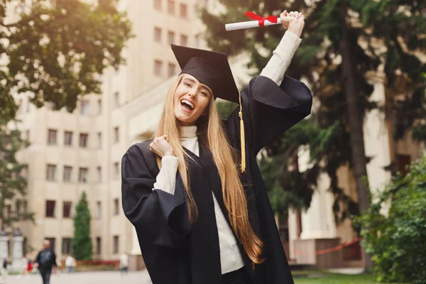 Happy young woman on her graduation day — Stock Photo, Image