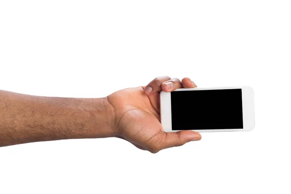 Χέρι που κατέχουν κινητά smartphone με την κενή οθόνη — Φωτογραφία Αρχείου