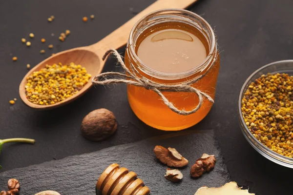 Jar of honey on wooden background — Stock Photo, Image