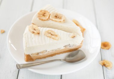 Delicious banana cake on table clipart