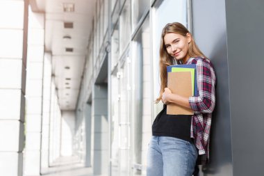Öğrenci kız kitapları Üniversitesi arka plan ile