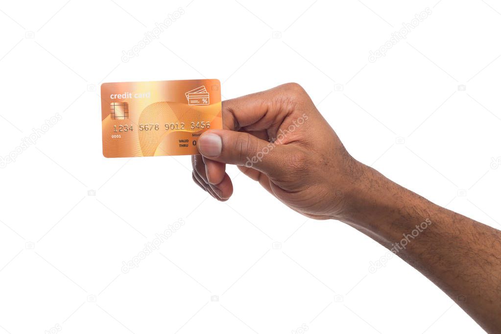 Close-up of male hand holding plastic card