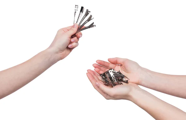 Female hands holding barrettes isolated on white — Stock Photo, Image