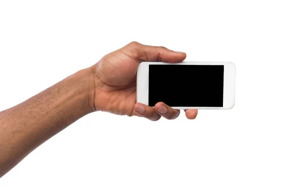 Mano que sostiene el teléfono inteligente móvil con pantalla en blanco — Foto de Stock