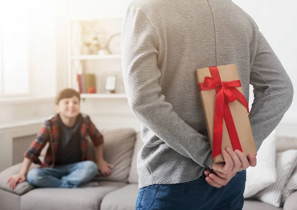 Father prepare gift to impressed son at home