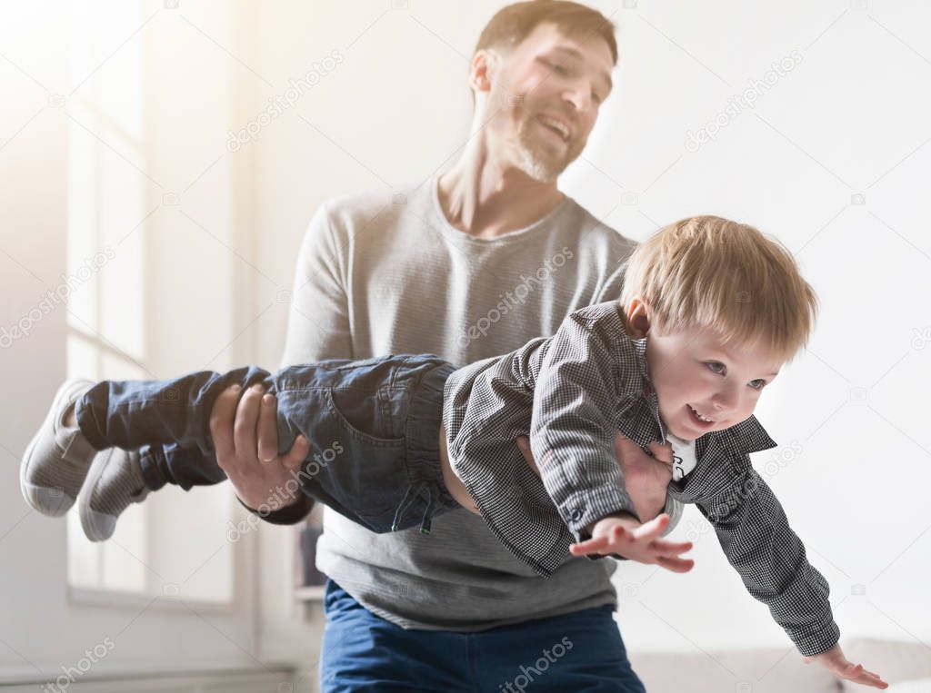 Father and son spending time together at home