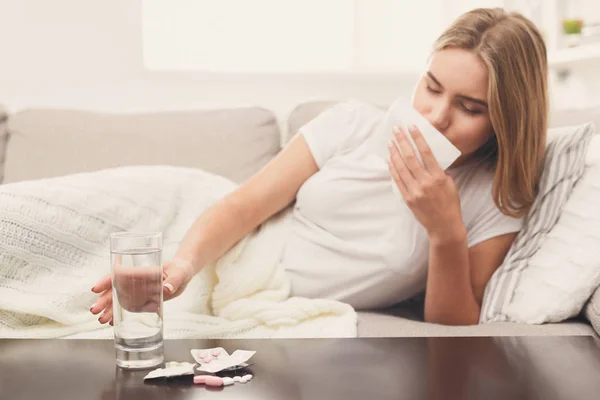 Sick woman lying in bed with fever and flu — Stock Photo, Image