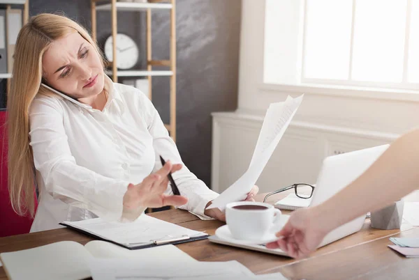 Photo of busy businesswoman refusing coffee cup