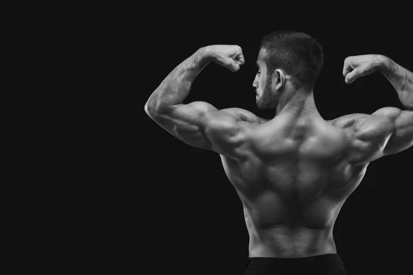 Homme méconnaissable montre des muscles du dos forts gros plan — Photo