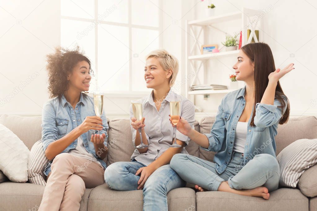 Friends toasting with wineglasses at home