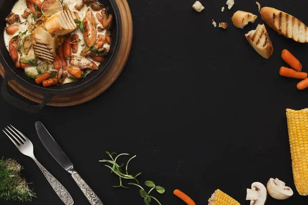 Meat and vegetable ragout on black table, top view — Stock Image Meat and vegetable ragout on black table, top view Royalty Free Stock Photos