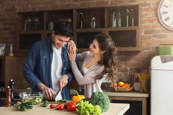 Happy couple cooking dinner together — Stock Photo, Image