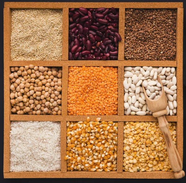 Cereals and legumes assortment in wooden box — Stock Photo, Image