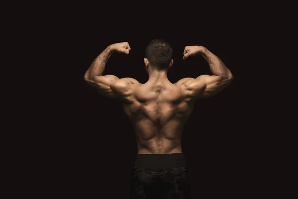 Homme méconnaissable montre des muscles du dos forts gros plan — Photo