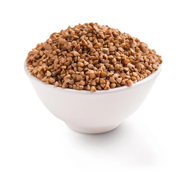 Dry buckwheat in ceramic bowl isolated on white — Stock Photo, Image