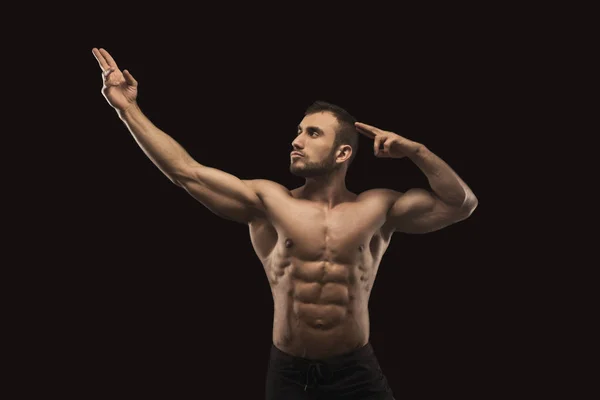 Forte atletico uomo mostra nudo corpo muscolare — Foto Stock