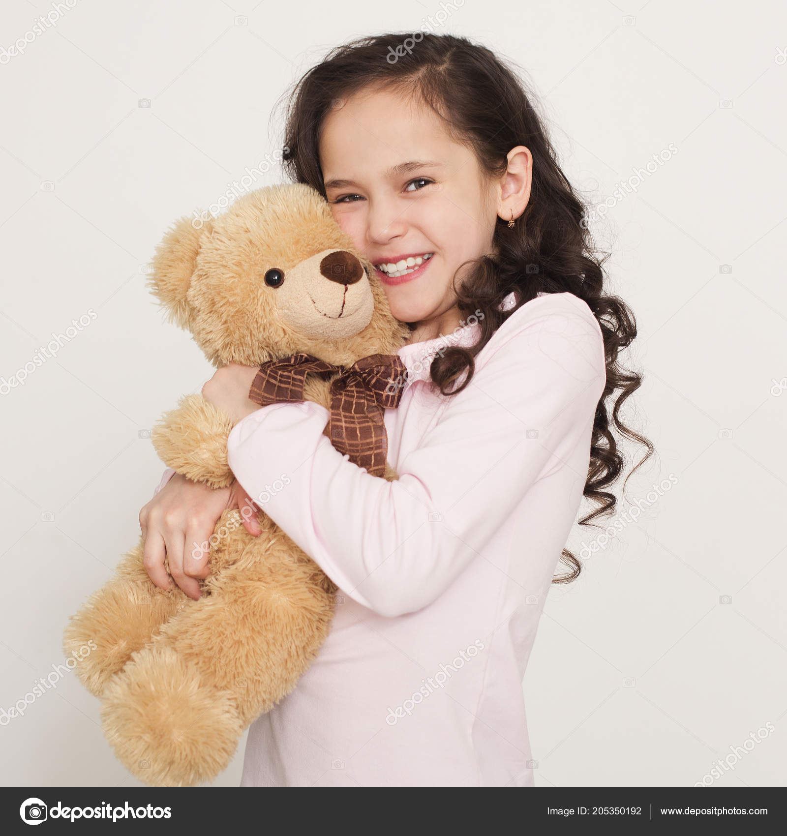 Photo: hugging teddy bear | Cute little girl hugging teddy bear — Stock ...